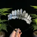 Crystal tiara detail featuring raw quartz points and an intricate bronze butterfly design. - White with Antique Bronze Butterfly