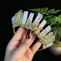 Close-up detail of the crystal quartz crown headband featuring golden rose and moon charms. - Pink Crystal + Gold Moon + Flower