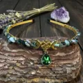 Close up of crystal gemstone headband with moon pentagram charm on tree bark background. - Indian Agate With Star Moon And Water Drop