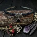 Detailed shot of handmade crystal moon headband with blue sandstone and pentagram charm. - Blue Sandstone With Star Moon And Black Droplet