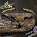 Close-up detail shot of the handmade crystal crescent moon and pentagram hair accessory. - Obsidian With Star Moon And Water Drop