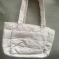 Lightweight pink quilted tote bag for women, stylish puffer handbag for daily travel and work. - Light Pink