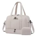 Detail view of beige travel duffel gym bag with shoe compartment and waterproof pocket design. - Light Gray