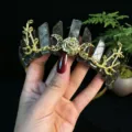 Close-up detail of the crystal crown featuring raw stones, golden crescent moon and rose. - Labradorite + Gold Moon + Flower
