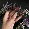 Close-up of gothic crystal headband featuring aura quartz, filigree moon and red rose. - Dark Purple and Black Wire and Antique Bronze Hollow Moon Flower