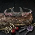 Handmade crystal moon tiara detail shot showing intricate wire-wrapped pink quartz stones. - Strawberry Quartz + Moon