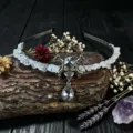 Gothic crystal skull headband detail showing handmade wire-wrapped quartz chips and teardrop pendant. - Rose Quartz With Skull And Clear Droplet