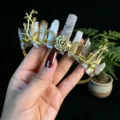 Detailed view of handmade gold crystal tiara headband with moon and rose elements for women. - Grey Agate + Gold Moon + Flower