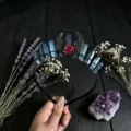 Crystal headband detail showing raw blue crystals, hollow moon and red rose crown close up. - Blue Gray and Black Wire and Antique Bronze Hollow Moon Flower