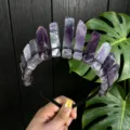 Detailed view of natural crystal crown headband with raw amethyst pillars for party photography. - Purple