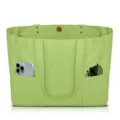 Green canvas tote bag detail showing outer pockets with phone, pen and sunglasses inside. - Light Green