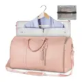 Détail de sac de voyage convertible rose avec compartiment pour vêtements et sangle. - Rose