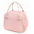 Close-up detail of the pink quilted lunch tote bag showing diamond stitching and front pocket. - 8.6 x 6.3 x 10.6 inches / Pink