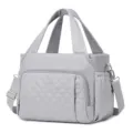 Grey quilted lunch bag for women with handles and shoulder strap, detail view of fabric. - 29.5 x 6.5 x 23CM / Silver