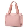 Pink canvas tote bag detail view, multi-pocket design, lightweight travel handbag for daily use. - Pink