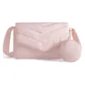 Detail view of the light pink quilted crossbody bag with chevron pattern and round pouch. - 11 x 3.1 x 6.7 Inches / Lotus Pink