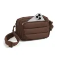 Brown quilted puffer crossbody bag with adjustable strap and front zipper pocket detail. - Coffee