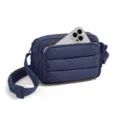 Dark blue quilted crossbody bag featuring front zipper pocket and adjustable strap detail. - Navy Blue