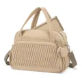 Close-up detail of quilted beige baby diaper bag showcasing texture, handles and side pouch. - Khaki