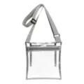 Clear crossbody bag detail showing transparent PVC material, zipper pocket, and adjustable strap. - Gray