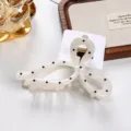 Elegant bow hair claw clip for women, chic polka dot hairpin, stylish hair accessory. - Streamer in Off-White
