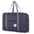 Foldable travel duffel bag in dark blue with gray handles for luggage and personal items. - Blue