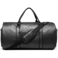 Detailed view of black travel duffel bag, showing sturdy handles and adjustable shoulder strap. - Black