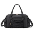 Black quilted travel duffel bag detail view, showing front braided pocket and side pockets. - Black