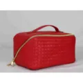 Red woven cosmetic bag, stylish travel toiletry organizer with handle and gold zipper closure. - Watermelon red