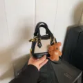 Kids mini shell crossbody bag with cute bear charm stylish contrast PU canvas handbag - Black Beige With Pendant