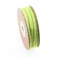 Close-up detail of light green wool felt cord on spool for DIY crafts and holiday decor. - Green