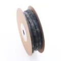 Detail view of dark grey wool felt cord wound on a cardboard spool for crafting projects. - Dark Gray