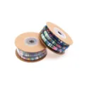 Detailed close-up of colorful ethnic style core-spun cord wound on craft paper spools. - Blue