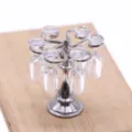 Close-up detail of miniature metal wine rack and hanging glasses for dollhouse scene. - Silver Set