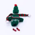 Detailed shot of miniature doll knitted sweater, matching hat, scarf, and cute red shoes. - Matching 1