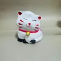 Hand-carved wooden cat figurine ornament detail view, cute artisan animal decor piece. - Chubby Bell Cat 6