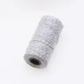 Close up detail of silver threaded white cotton twine roll, perfect for gift wrapping string. - 2mm * 100m / Silver