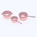 Detailed close-up view of miniature metal soup pots for dollhouse kitchen toy models. - Three-Piece Set