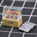 Miniature dollhouse food display cabinet model with barbecue skewers and tray props. - Oden Skewer