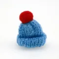 Mini knitted wool hat with red pom-pom, cute craft accessory for DIY hair clips or doll decor. - Blue