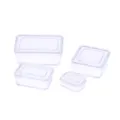 Closeup detail of dollhouse miniature transparent plastic storage box, micro food play scene. - White