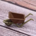 Miniature plastic wheelbarrow toy detail view for dollhouse farm tool model decor. - Brown