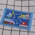 Miniature construction vehicle embroidered carpet detail for dollhouse scene decoration. - Architecture