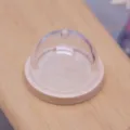 Miniature dollhouse clear plastic cake dome with wood base detail view for doll food play. - Natural