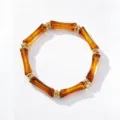 Bracelet rétro en acrylique ambré segmenté façon bambou avec anneaux dorés, bijou tendance. - Style Bambou Ambre (JMX-SL9682-B) / Ambre