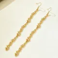 Gold molten texture irregular metal earrings, unique long wavy drop design for women jewelry. - Long Drop Earrings (JMX-TZ9749)
