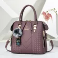 Stylish purple embossed tote bag with cute pompom charm, versatile casual shoulder bag. - Pom-pom Keychain / Purple