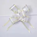 White pull bow with gold trim, elegant ribbon bow for gift wrapping and wedding decor. - 100pcs Pack / White Gold Edge