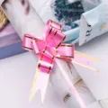 Pink ribbon bow with gold edge for gift wrapping, decorative floral packaging accessory. - Pink Gold Edge