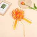 Large orange sheer ribbon bow with gold edge for gift wrapping and holiday party decoration. - 10 Strands Pack / Gold